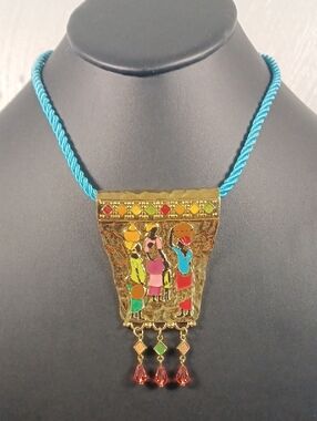 "The Gathering" Goldtone Pendant On Blue Rope 18"